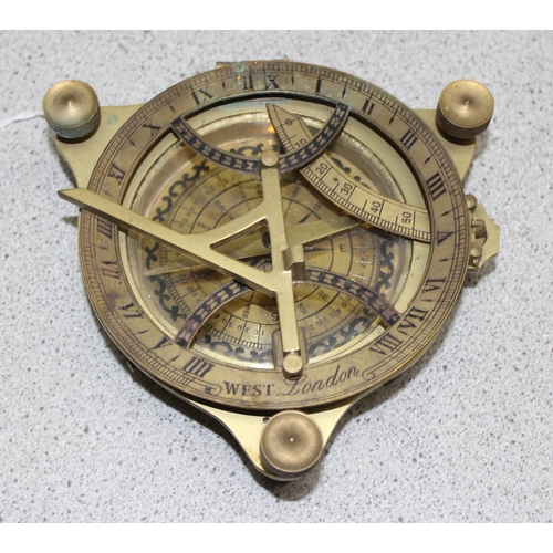 675 - 1960’s retro Bakelite style circular desk aneroid barometer on stand and a large 13cm diameter brass... 