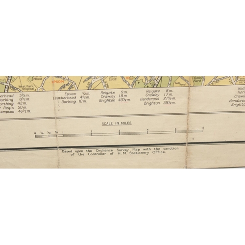 558 - Mixed lot of British maps to include an early 20th E.J Larby linen backed map titled 'through route ... 