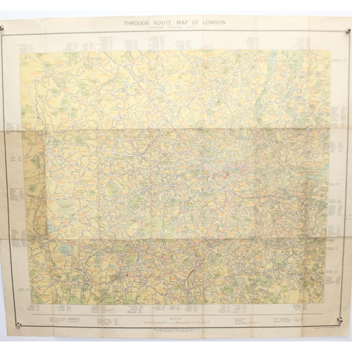 558 - Mixed lot of British maps to include an early 20th E.J Larby linen backed map titled 'through route ... 