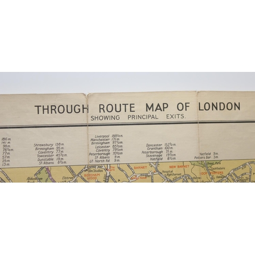 558 - Mixed lot of British maps to include an early 20th E.J Larby linen backed map titled 'through route ... 