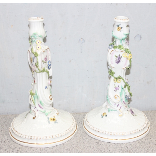 1650A - A pair of 19th century Dresden porcelain candlesticks with encrusted floral decoration and hand pain... 