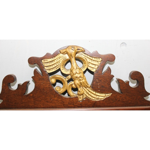 442 - A Georgian style wooden and gilt framed fretwork mirror with carved details, approx 70cm x 40cm