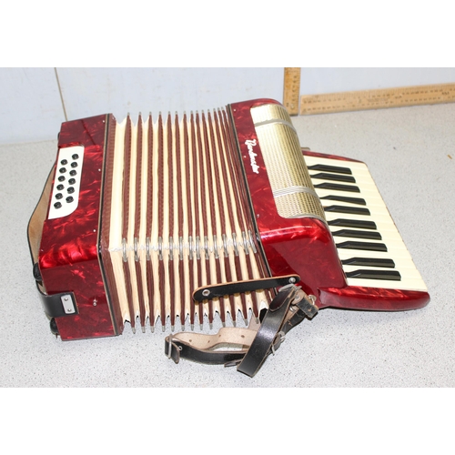 607 - Cased Bandmaster accordion with red marbled finished