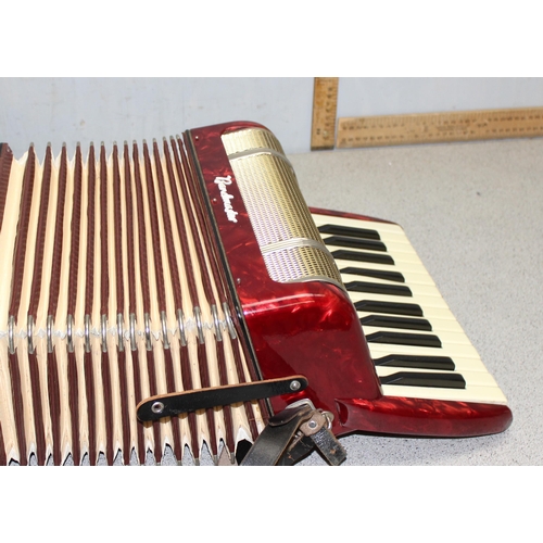 607 - Cased Bandmaster accordion with red marbled finished