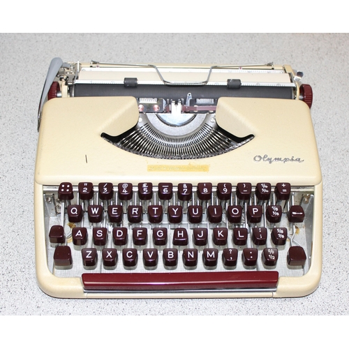 688 - A vintage West German made Olympia typewriter in case