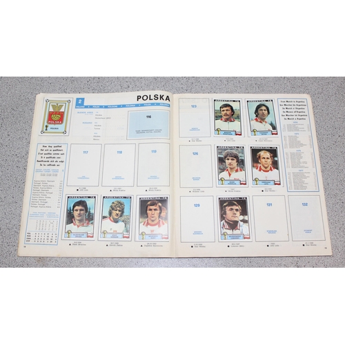 710 - A partially complete Panini World Cup 1978 sticker album, an AVA Football Special 79 album with some... 