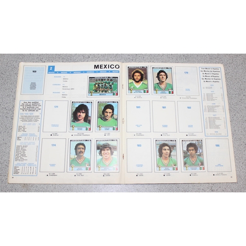 710 - A partially complete Panini World Cup 1978 sticker album, an AVA Football Special 79 album with some... 