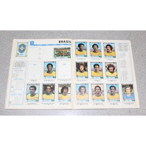 710 - A partially complete Panini World Cup 1978 sticker album, an AVA Football Special 79 album with some... 