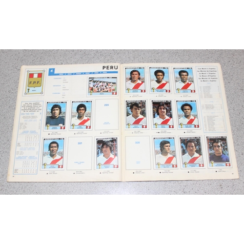 710 - A partially complete Panini World Cup 1978 sticker album, an AVA Football Special 79 album with some... 