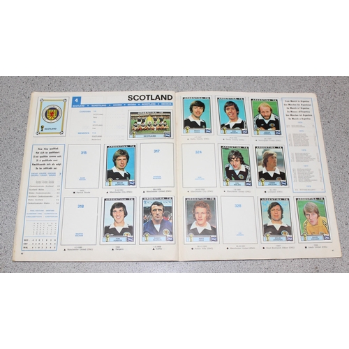 710 - A partially complete Panini World Cup 1978 sticker album, an AVA Football Special 79 album with some... 