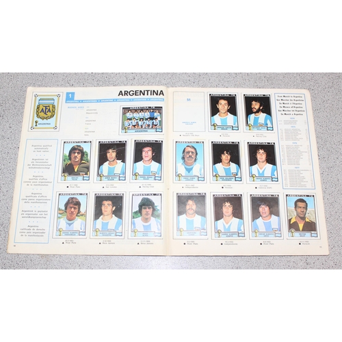 710 - A partially complete Panini World Cup 1978 sticker album, an AVA Football Special 79 album with some... 