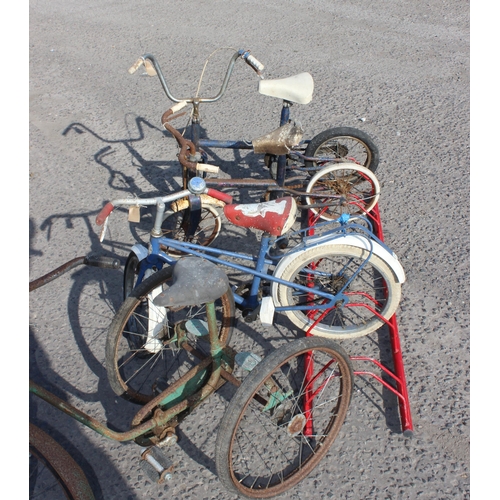 713 - 3 small children's bikes and a tricycle for parts