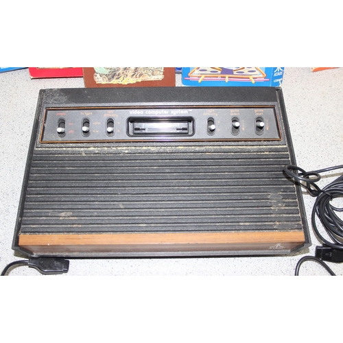 1509 - Atari video computer system games console, with 2 joysticks and 7 games (all present)