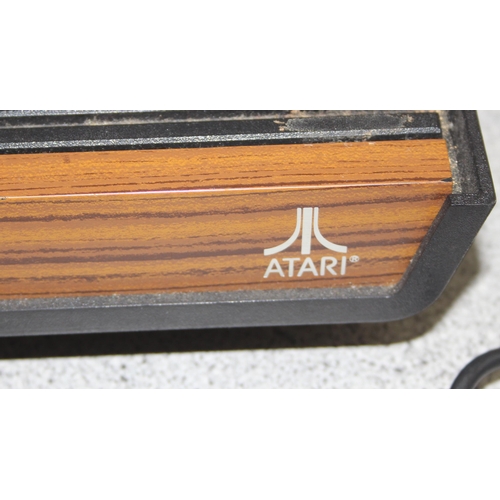 1509 - Atari video computer system games console, with 2 joysticks and 7 games (all present)