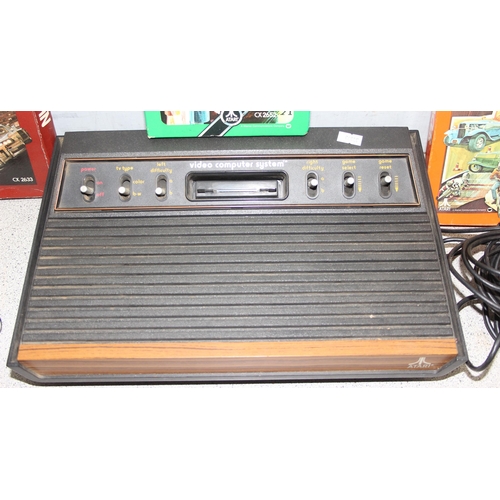 1510 - Atari video computer system games console, with 2 paddles and 3 games (all present)