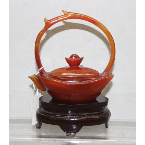 1613 - Small carved hard-stone oriental tea-pot on stand, possibly Agate, height with stand approx 19cm