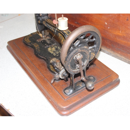 819 - Antique Bradbury & Co No. 1 crank handle sewing machine in wooden case