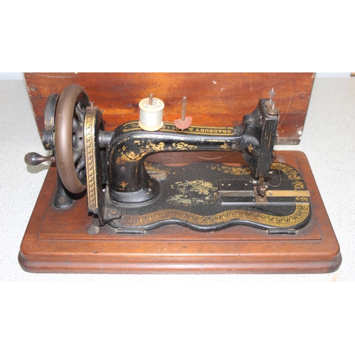 819 - Antique Bradbury & Co No. 1 crank handle sewing machine in wooden case