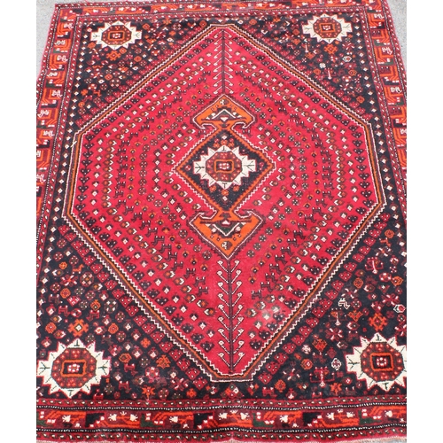 204 - A large vintage Abadeh rug of red ground, approx 294cm x 213cm