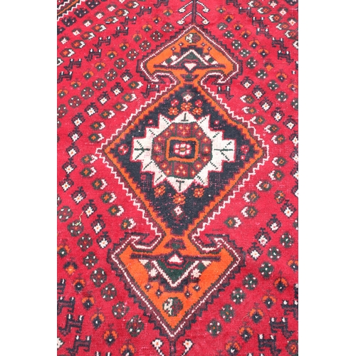 204 - A large vintage Abadeh rug of red ground, approx 294cm x 213cm