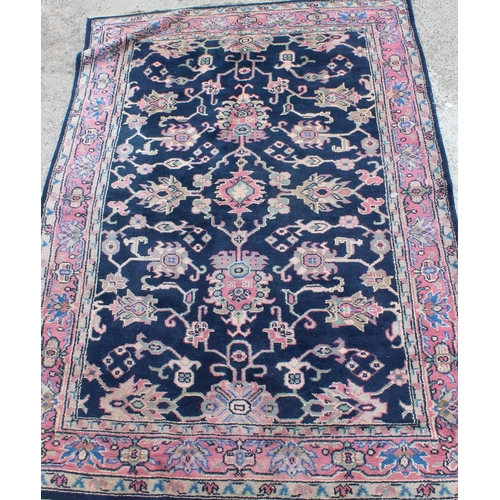 206 - A vintage blue ground Persian Sarouk rug, approx 295cm x 202cm