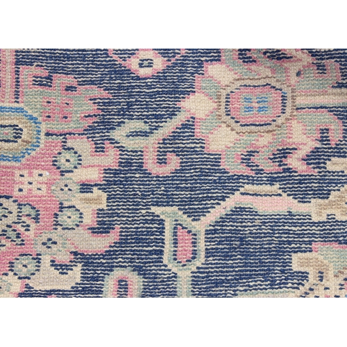 206 - A vintage blue ground Persian Sarouk rug, approx 295cm x 202cm