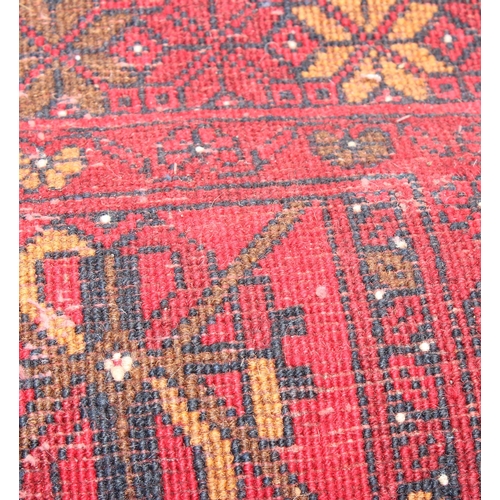 207 - A large vintage red ground runner rug, approx 295cm x 83cm