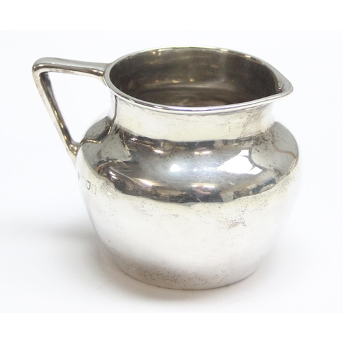 1030 - A small vintage silver cream jug, London mark with date letter and makers mark rubbed, approx 98.51g... 