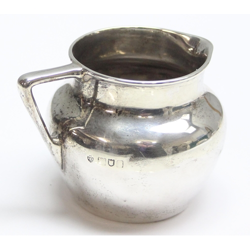 1030 - A small vintage silver cream jug, London mark with date letter and makers mark rubbed, approx 98.51g... 