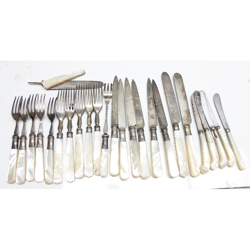 1041 - A large qty of assorted mother of pearl handled cutlery, many with silver collars