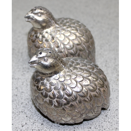 1048 - In the manner of Gucci, a pair of silver plated sugar castors formed as Quails, approx 9cm wide