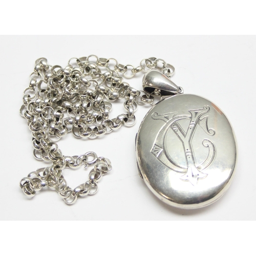 1146 - A large antique silver locket on a modern 925 silver chain, the locket seemingly unmarked but XRF te... 