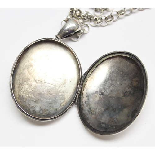 1146 - A large antique silver locket on a modern 925 silver chain, the locket seemingly unmarked but XRF te... 