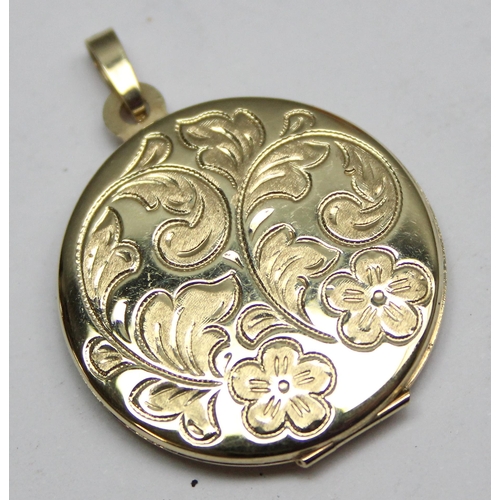 1147 - 9ct gold circular pendant locket with engraved decoration, approx 3.12g gross