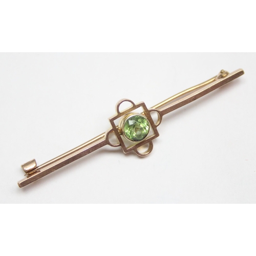 1148 - An antique 9ct gold bar brooch set with Peridot, seemingly unmarked but XRF tests as 9ct gold, appro... 