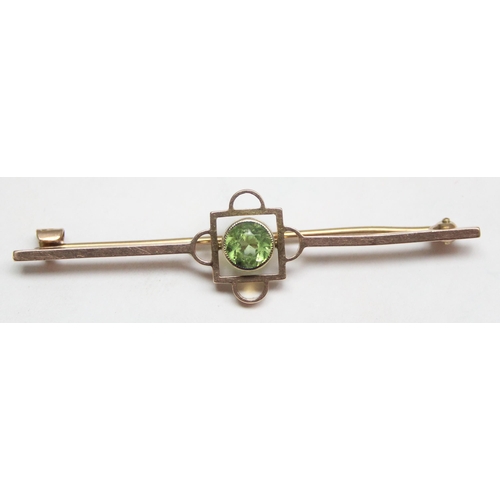 1148 - An antique 9ct gold bar brooch set with Peridot, seemingly unmarked but XRF tests as 9ct gold, appro... 