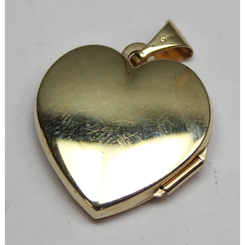 1152 - A 9ct gold heart shaped locket set with white stone, approx 1.93g gross