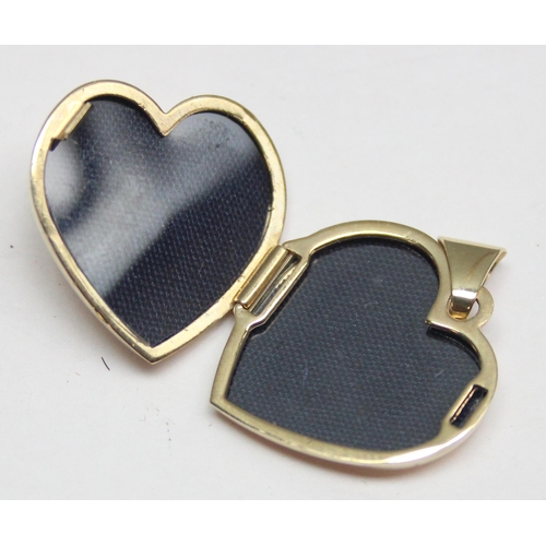 1152 - A 9ct gold heart shaped locket set with white stone, approx 1.93g gross