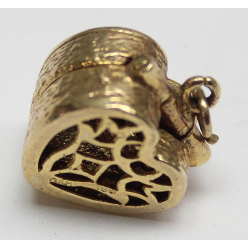 1157 - 9ct gold charm formed as a pierced heart shaped box containing a miniature engagement ring, approx 5... 