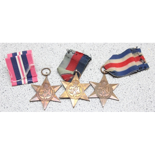 1433 - 4 assorted WW2 medals and a Regular Army certificate of service book