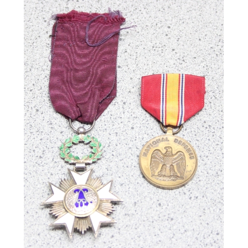 1435 - Belgian Order of the Crown medal in silver gilt and a USA National Defence medal (2)