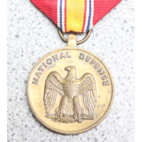 1435 - Belgian Order of the Crown medal in silver gilt and a USA National Defence medal (2)