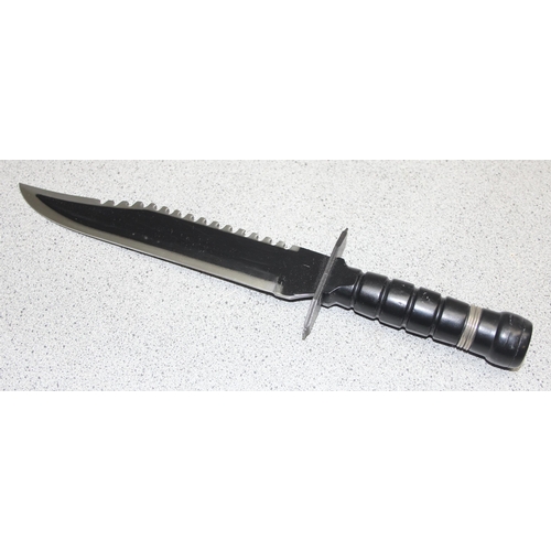 1450 - Large survival knife in sheath, blade measures approx. 25cm