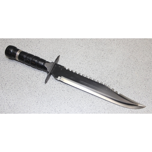 1450 - Large survival knife in sheath, blade measures approx. 25cm