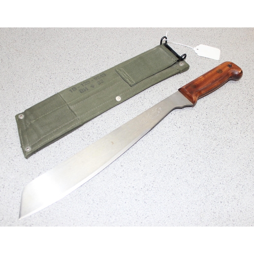 1451 - British Army machete in sheath, blade measures approx. 33cm