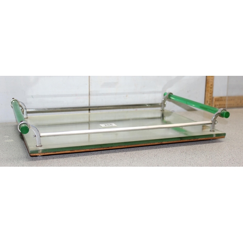 288 - An Art Deco period mirrored serving tray with chrome gallery and green Lucite handles, approx 48cm x... 