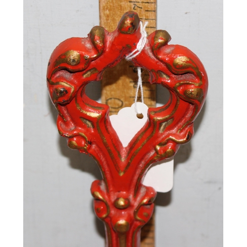 291 - 2 antique style door stops, red and cream painted with gilt highlight, one marked Kenrick 466