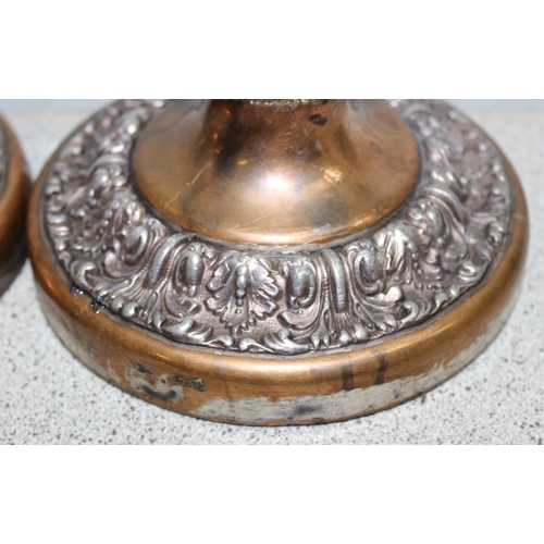 1004 - Pair of copper candlesticks with silver plated decoration