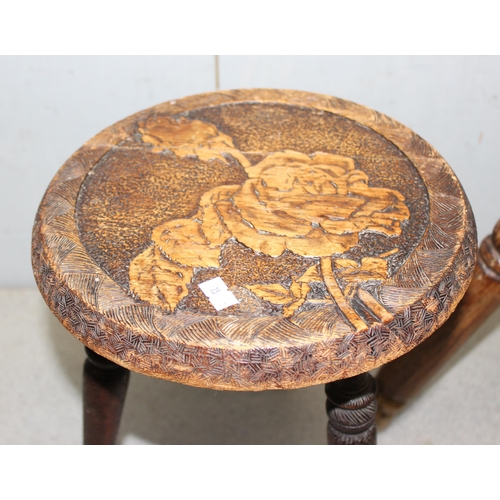 143 - 2 vintage milking stools to include 1 pokerwork example decorated with a rose