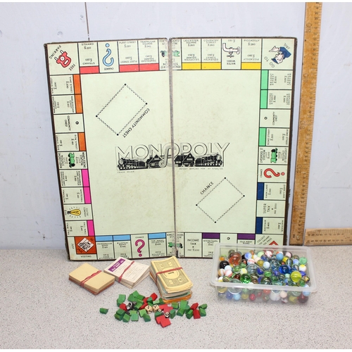 1500 - Qty of glass marbles and a vintage monopoly set (unboxed)